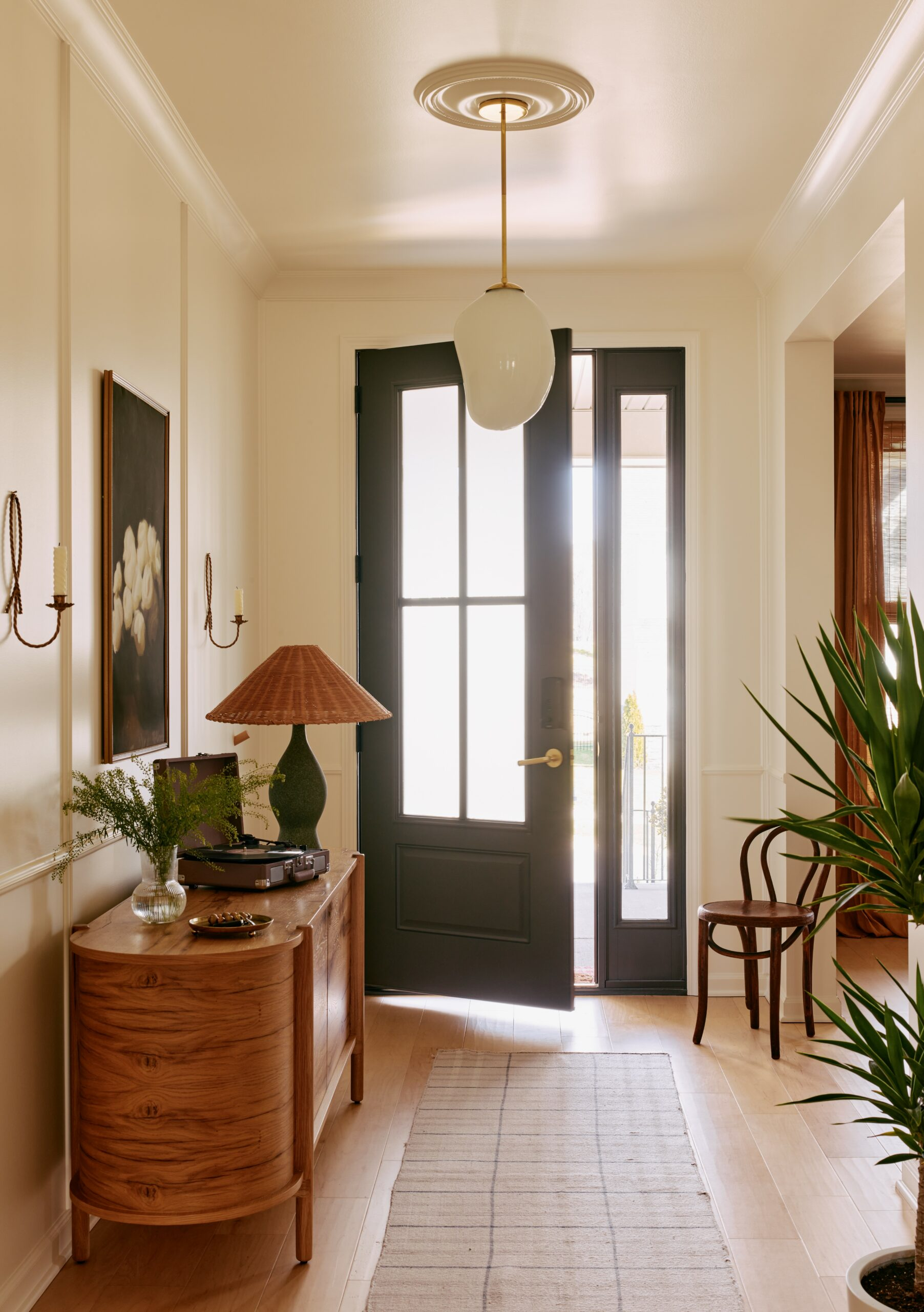 Full Service Interior Design Firm Bodesign Studio transformed a bland entryway into a warm and inviting space